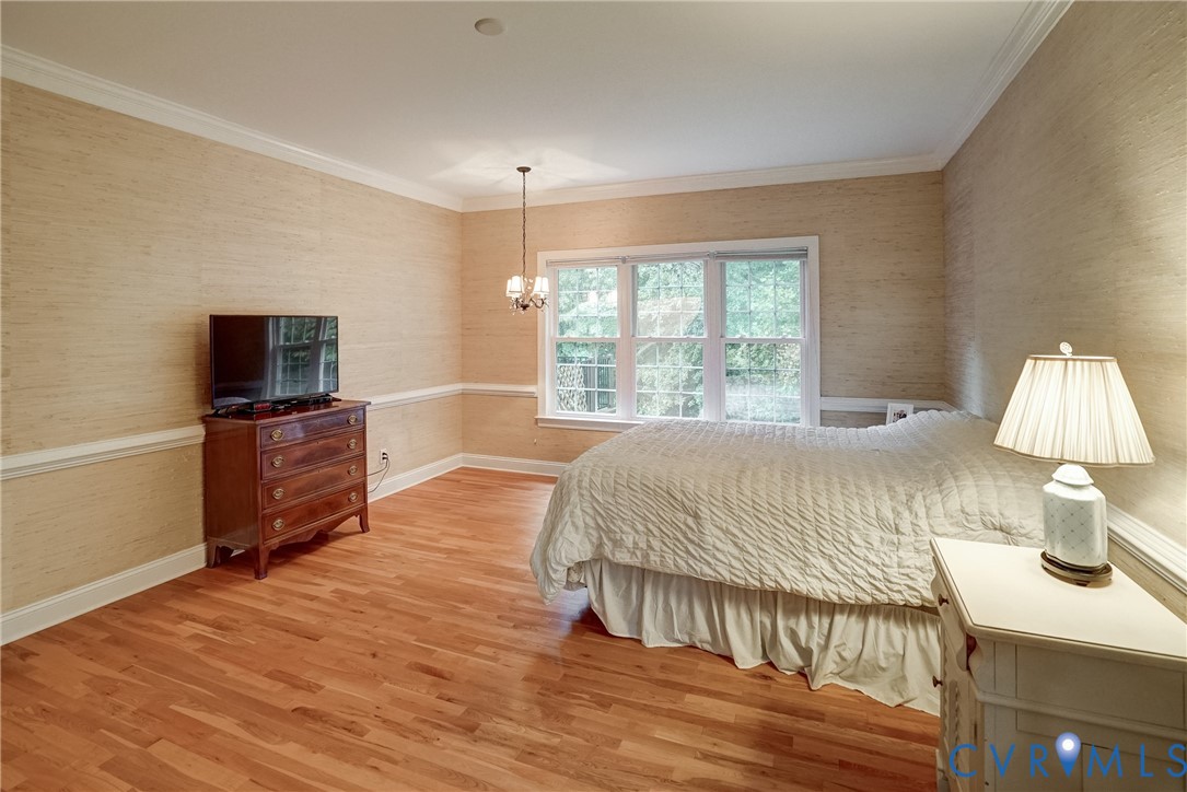 11600 Park Branch Lane Chesterfield, VA 23838 - Photo 24 of 47 a spacious bedroom with a bed and a flat screen tv