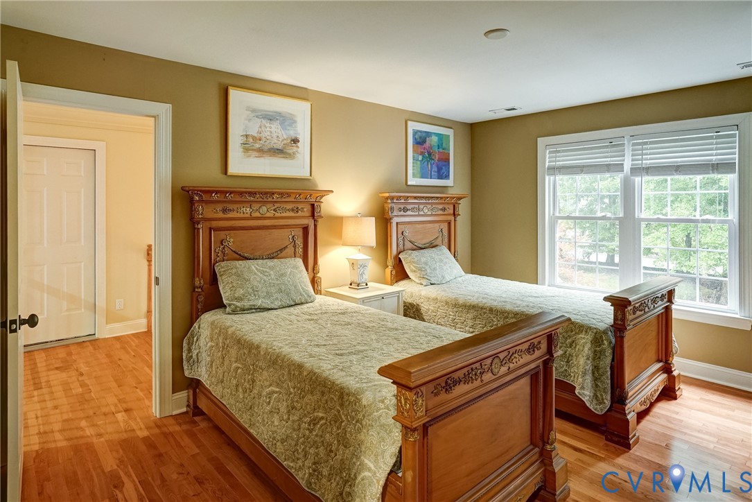 11600 Park Branch Lane Chesterfield, VA 23838 - Photo 31 of 47 a bed sitting in a bedroom next to a window