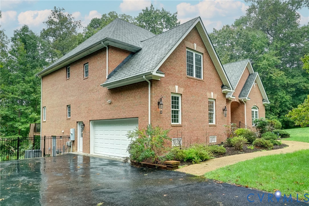 11600 Park Branch Lane Chesterfield, VA 23838 - Photo 40 of 47 a front view of a house with a yard and garage