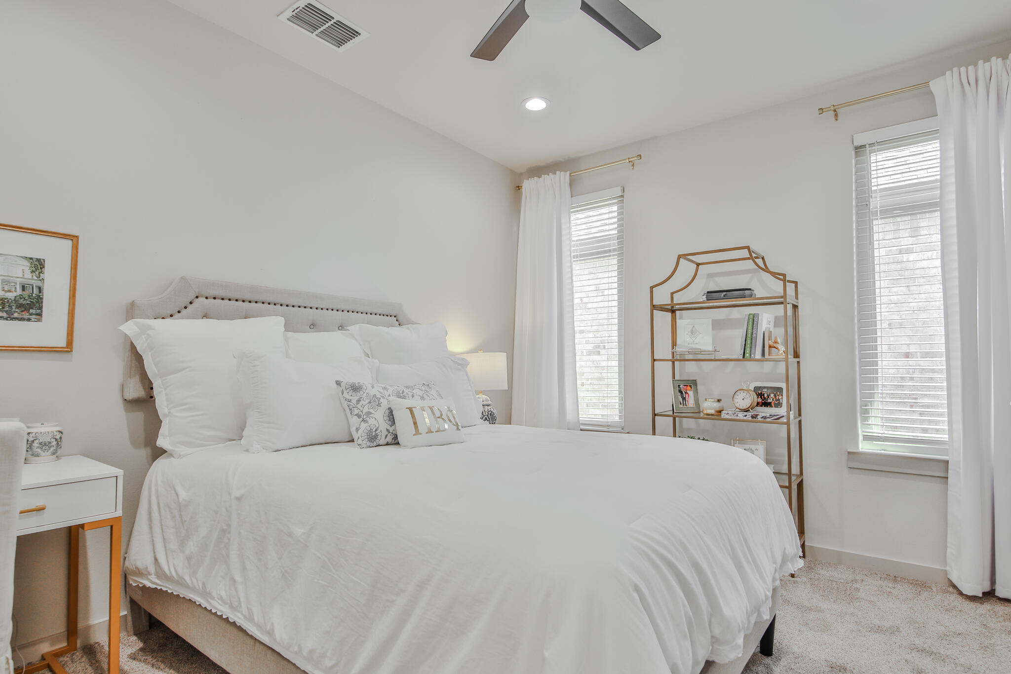 3806 59th Street Lubbock, TX 79413 - Photo 24 of 38 a bedroom with a large bed and a window