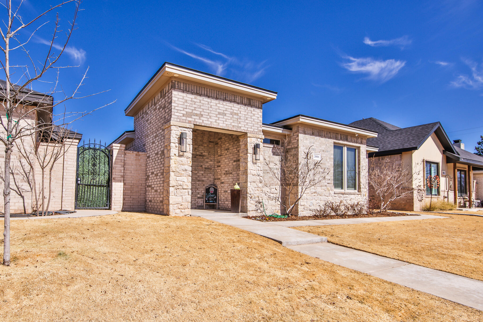 3806 59th Street Lubbock, TX 79413 - Photo 3 of 38 a front view of a house with a yard
