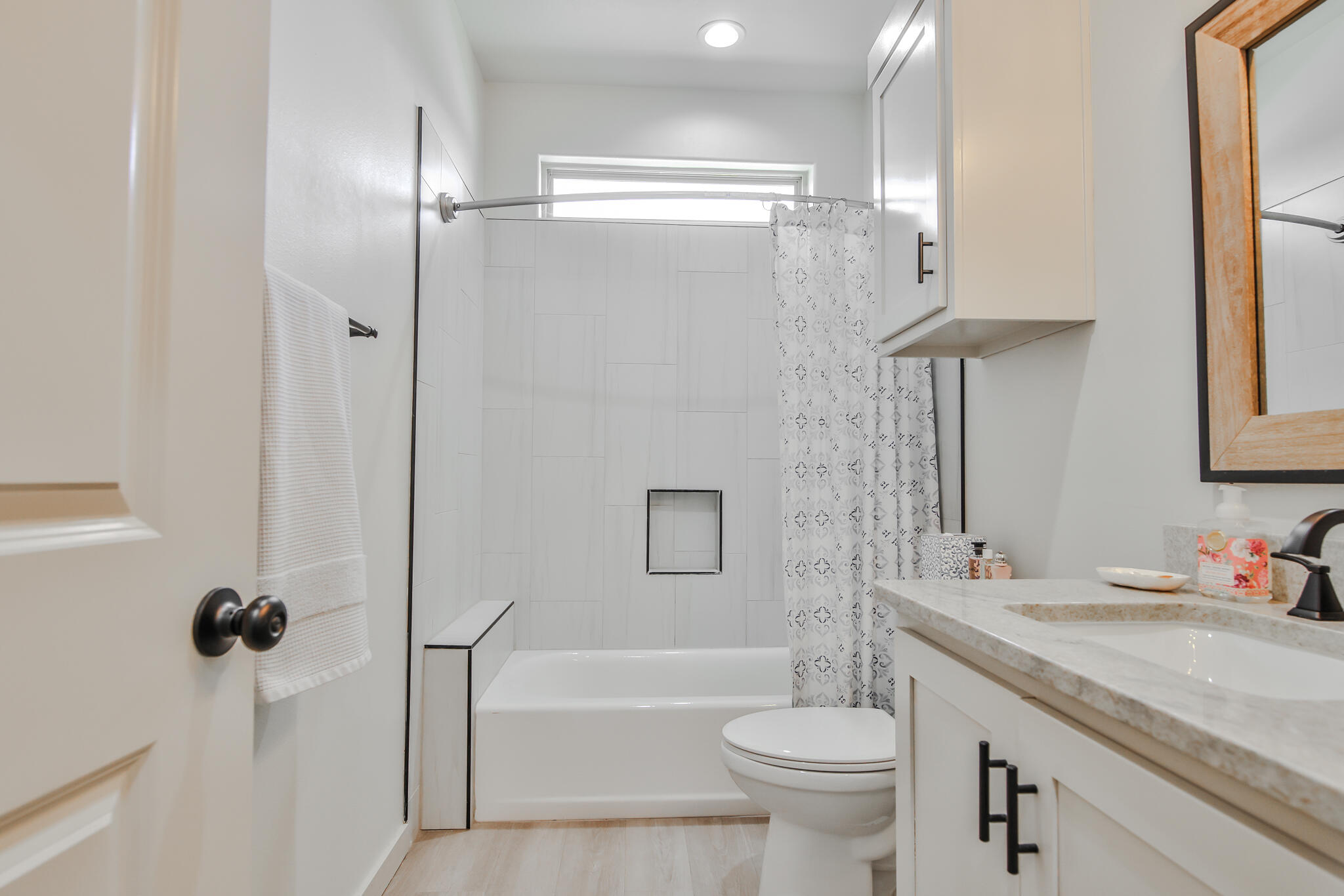 3806 59th Street Lubbock, TX 79413 - Photo 31 of 38 a bathroom with a granite countertop sink toilet and shower