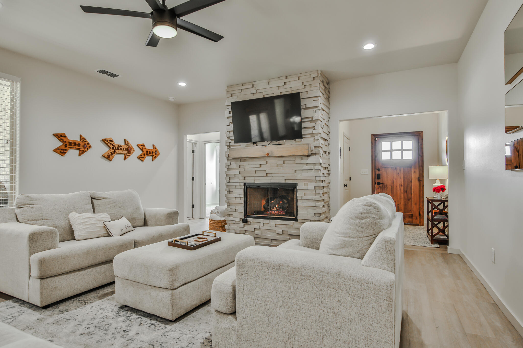3806 59th Street Lubbock, TX 79413 - Photo 7 of 38 a living room with furniture fireplace and flat screen tv