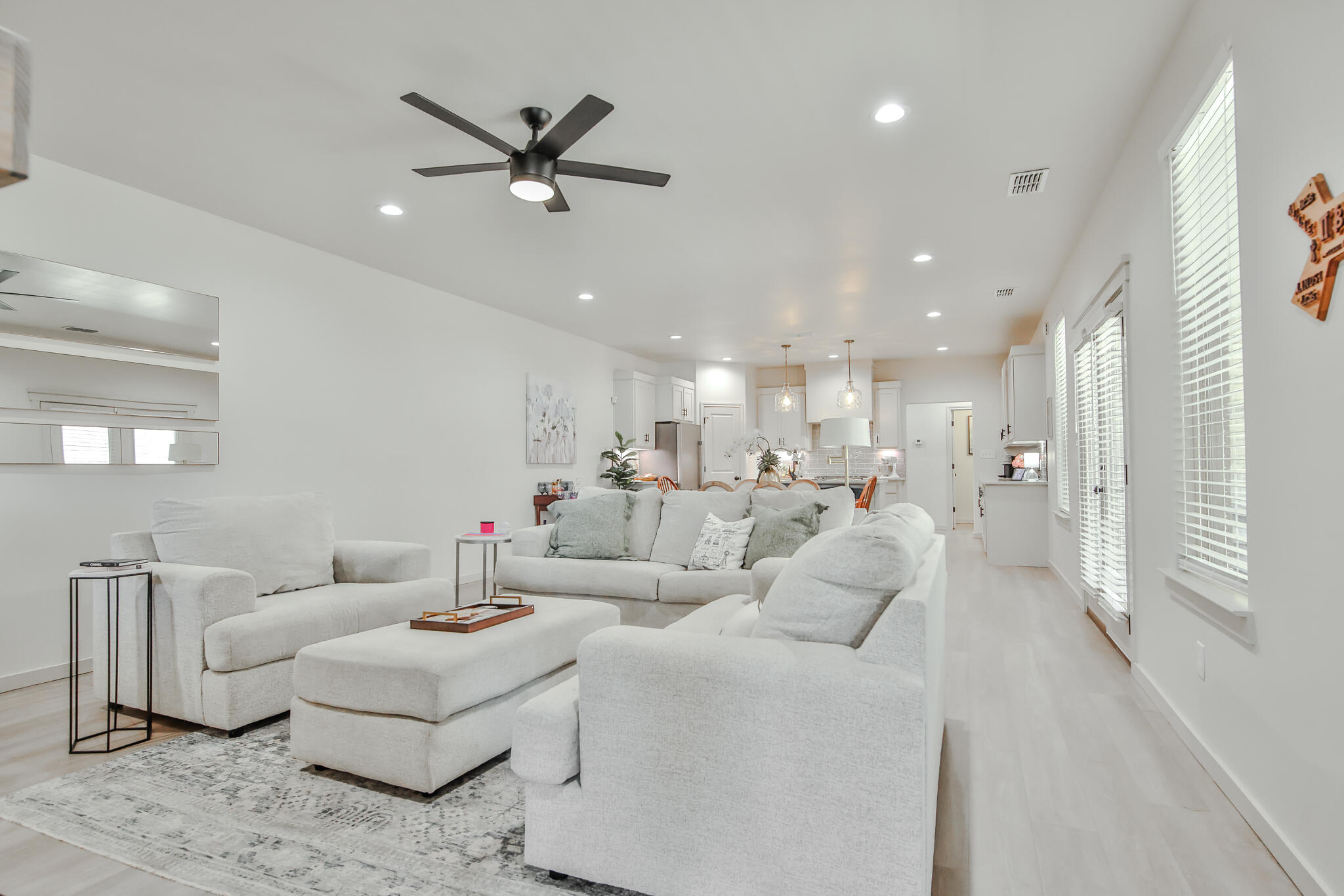 3806 59th Street Lubbock, TX 79413 - Photo 10 of 38 a living room with furniture and a ceiling fan