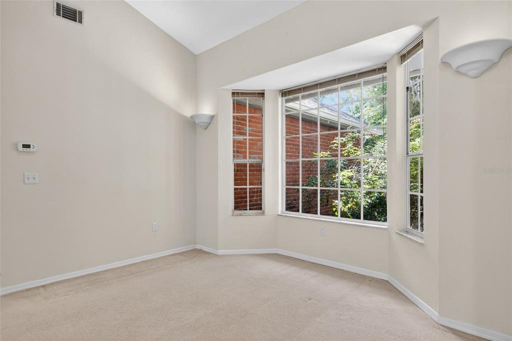 9626 Southwest 53rd Road Gainesville, FL 32608 - Photo 6 of 23 an empty room with a window