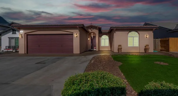 a front view of a house with a yard
