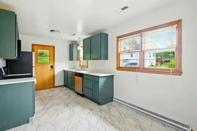 a bathroom with sink and window