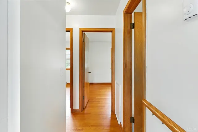 a view of a bathroom from a hallway