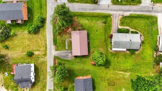 a view of a yard with table and chairs