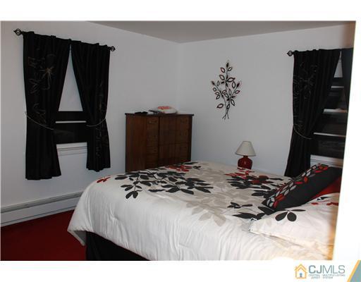 4 Gurley Road Edison, NJ 08817 - Photo 6 of 7 a bedroom with a bed and a window