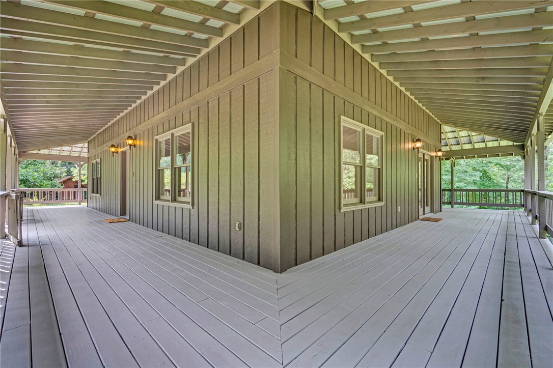 120 Patterson Ridge Road Salem, SC 29676 - Photo 30 of 46 An inviting wraparound porch with sturdy wood flooring offers abundant outdoor living space.