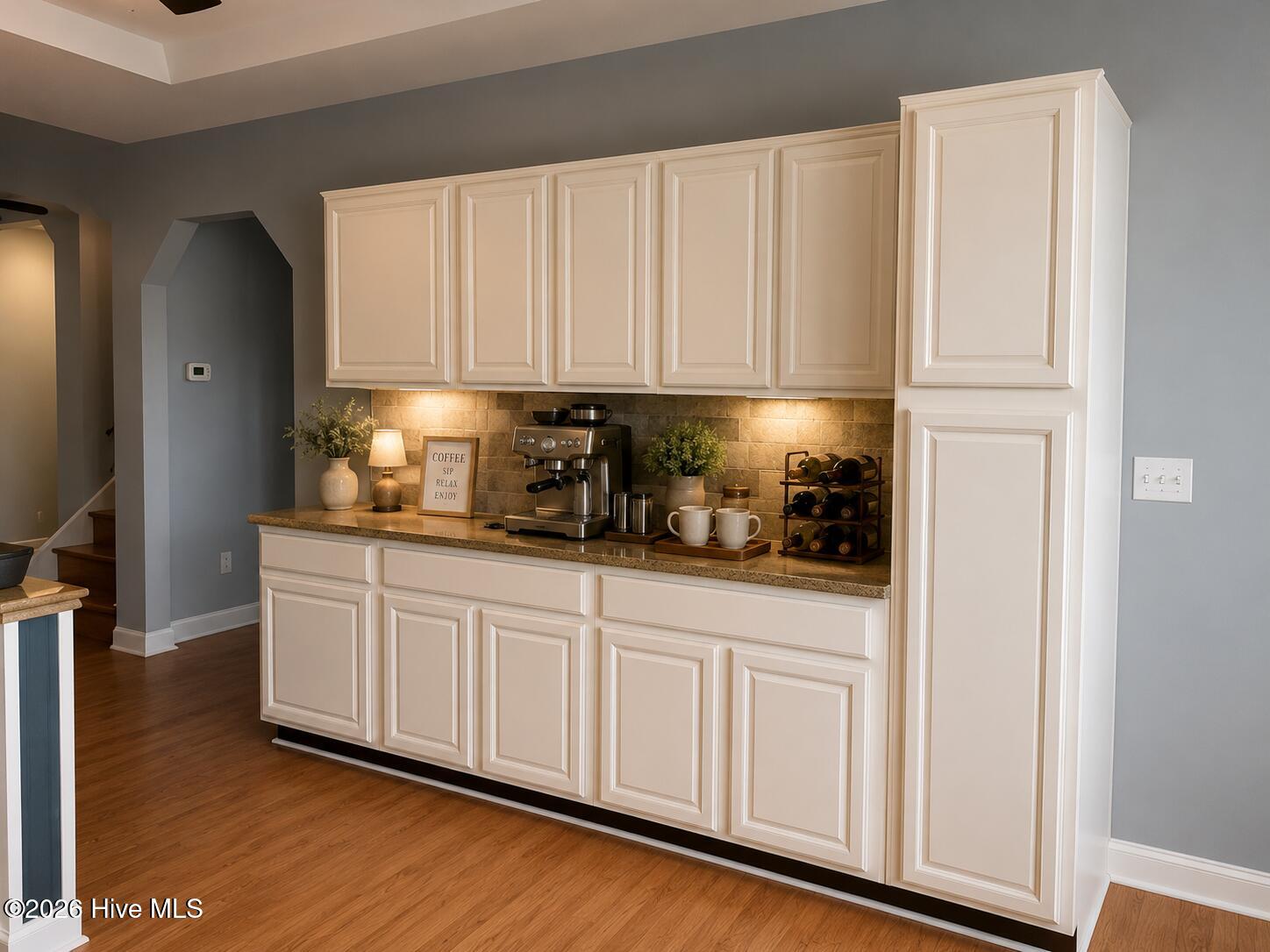 477 Harkers Island Road Beaufort, NC 28516 - Photo 12 of 38 Built-in cabinetry offers exceptional storage and was virtually staged to inspire a cozy coffee and entertaining station