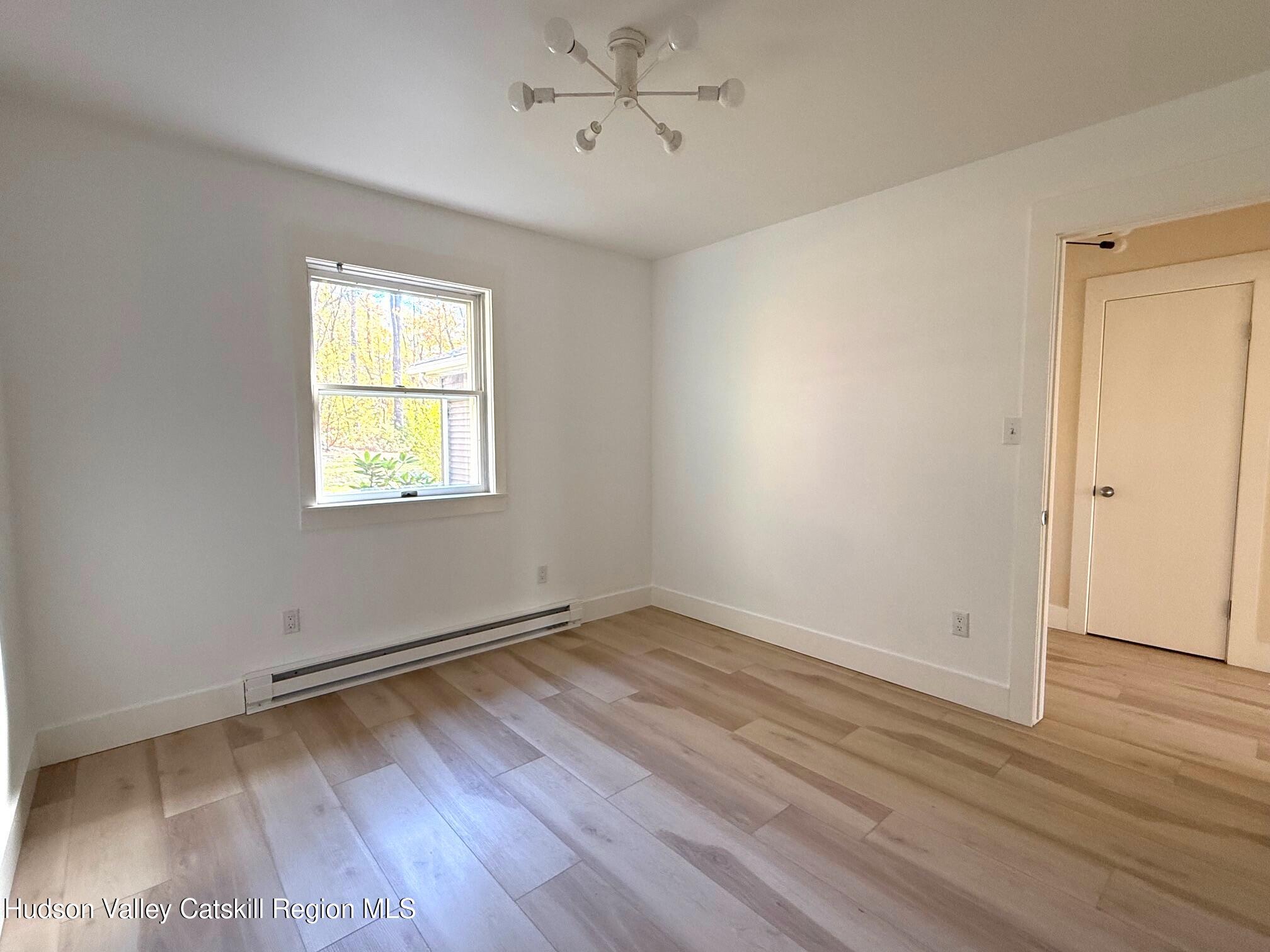 5265 County Rt 9g Germantown, NY 12526 - Photo 12 of 35 an empty room with wooden floor and windows