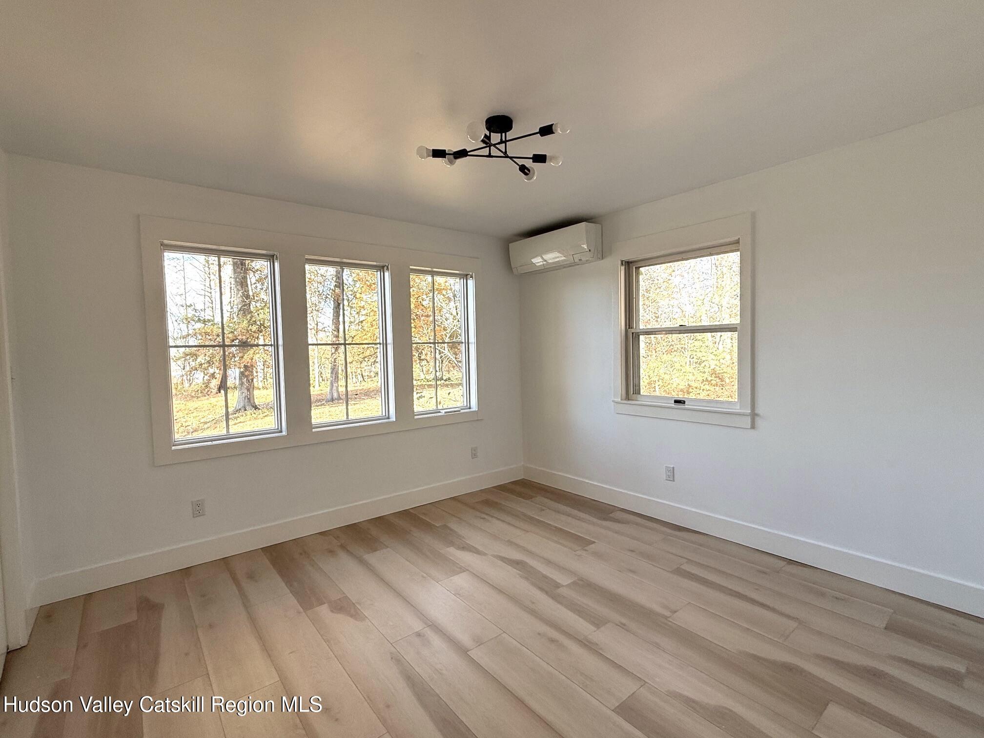 5265 County Rt 9g Germantown, NY 12526 - Photo 16 of 35 a view of an empty room with wooden floor and a window