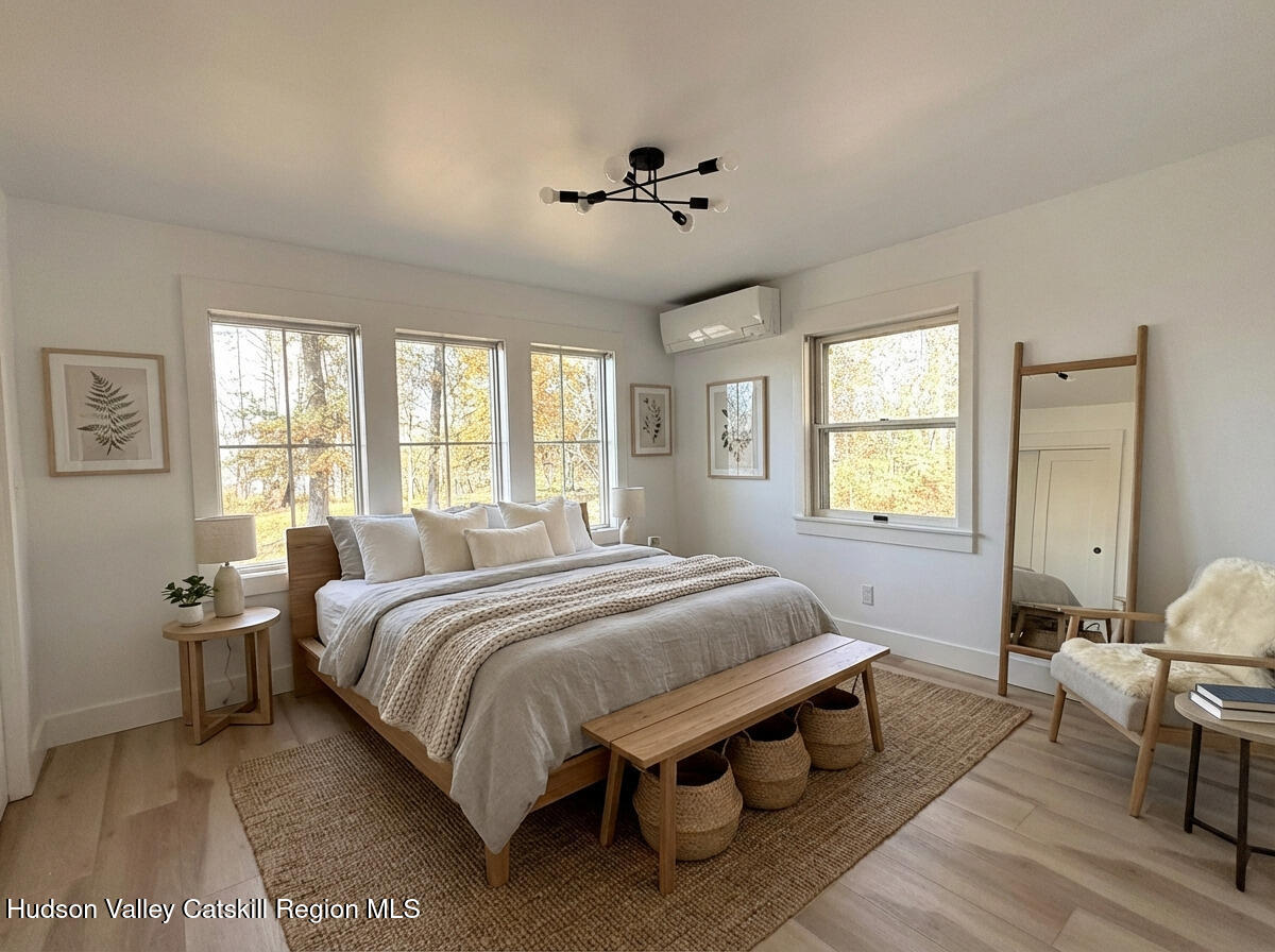 5265 County Rt 9g Germantown, NY 12526 - Photo 17 of 35 a bedroom with a bed and wooden floor