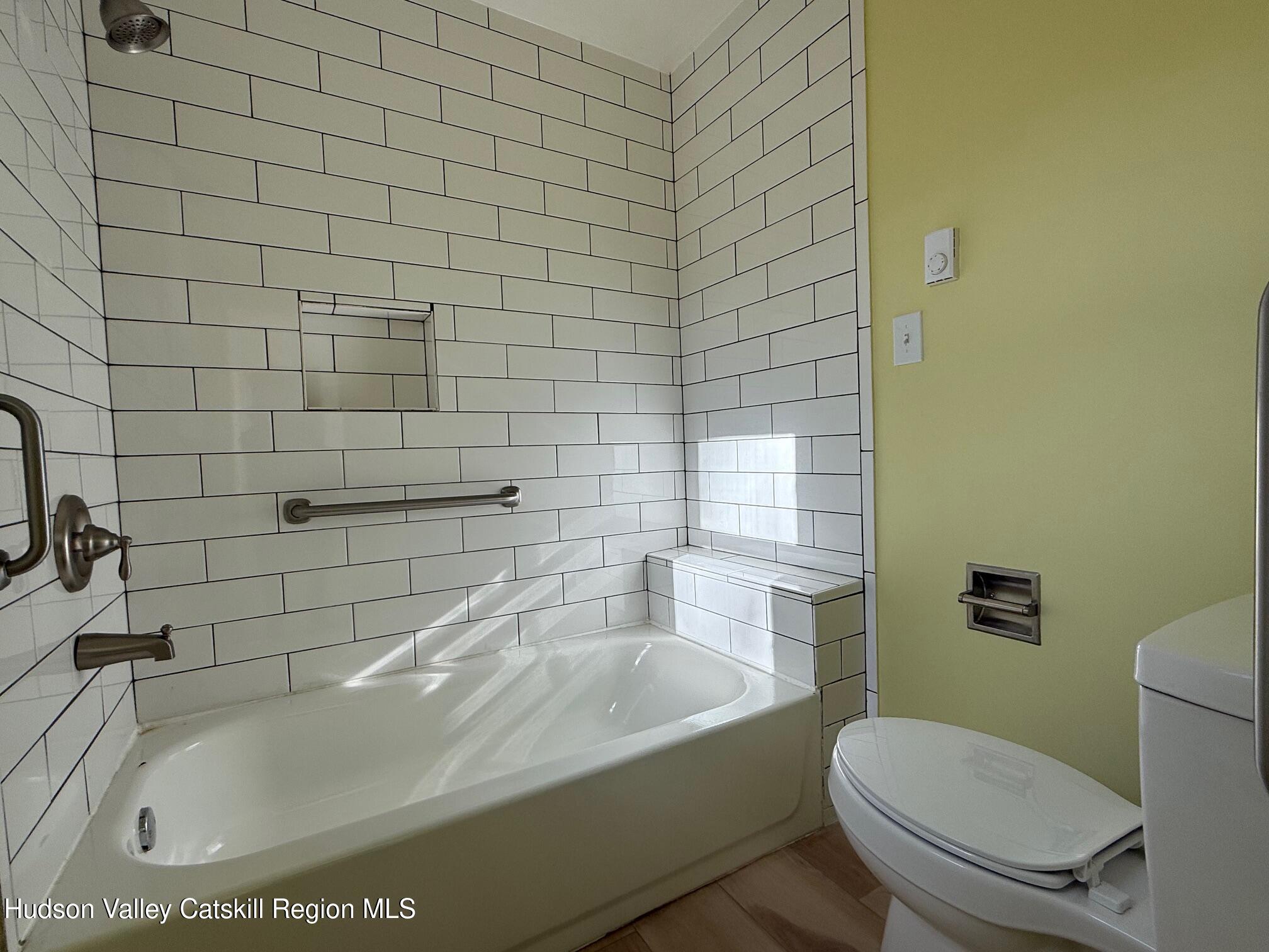 5265 County Rt 9g Germantown, NY 12526 - Photo 24 of 35 a white bath tub sitting next to a white toilet