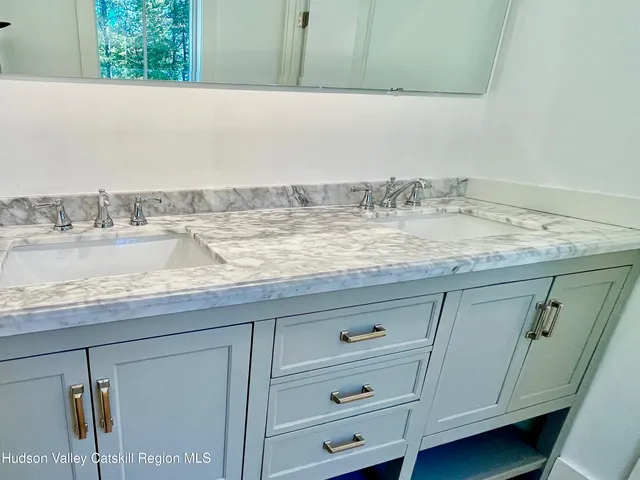 a view of sink and cabinets