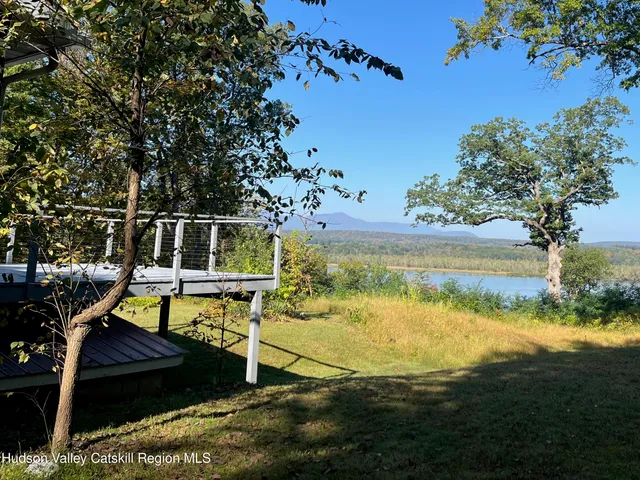 a view of a swimming pool with a lake