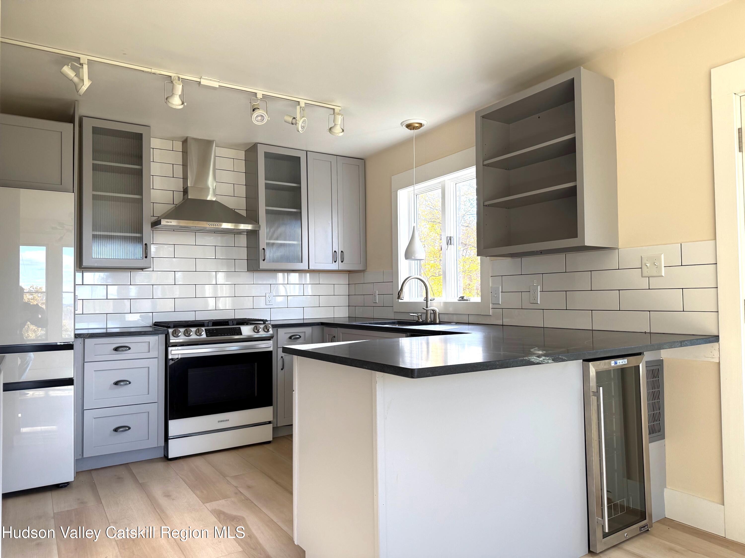 5265 County Rt 9g Germantown, NY 12526 - Photo 9 of 32 a kitchen with stainless steel appliances granite countertop a sink and a stove