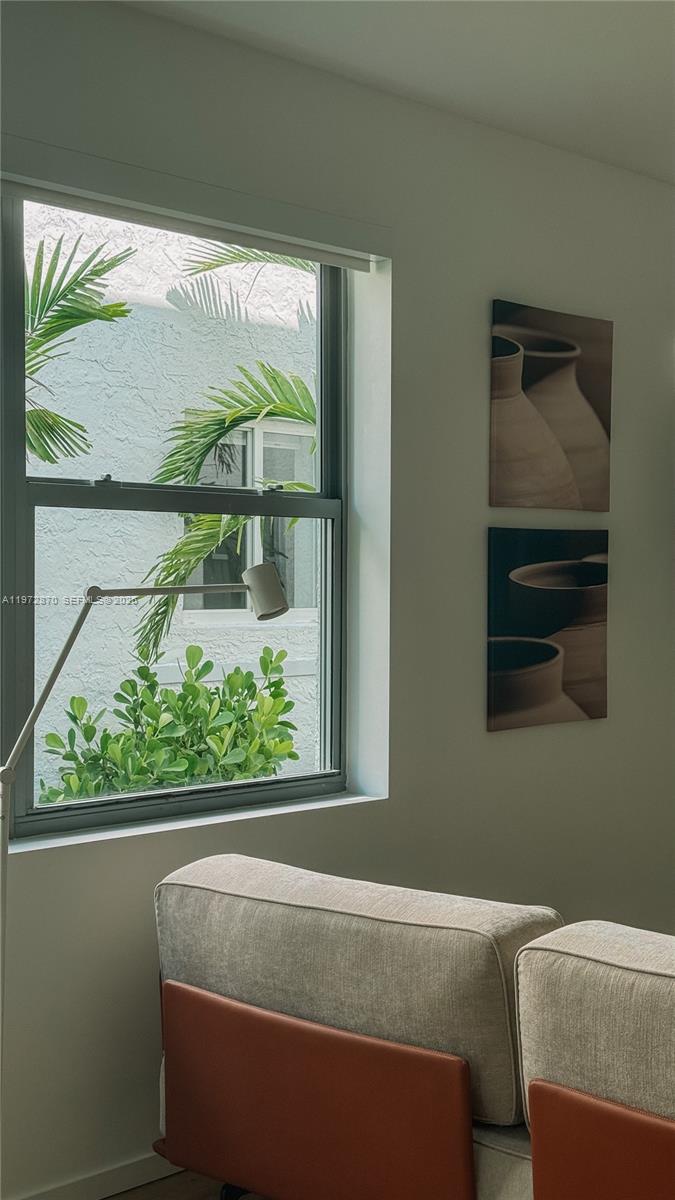 128 Northeast 46th Street, Unit 3 Miami, FL 33137 - Photo 11 of 17 a room with a bed