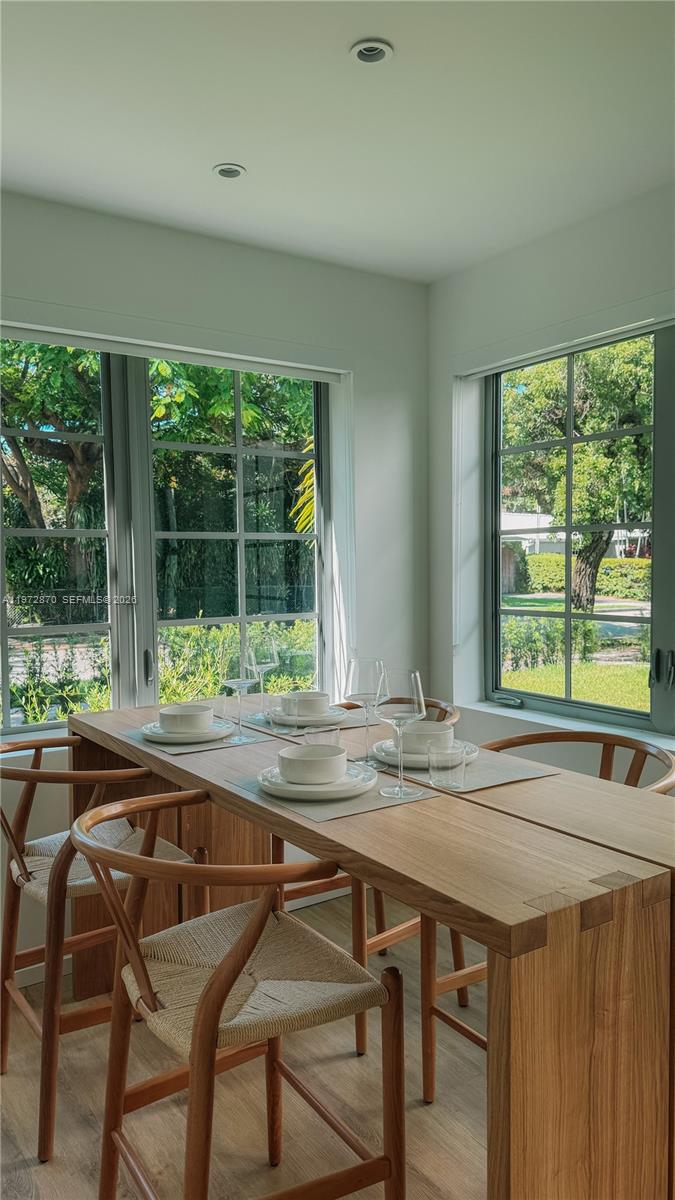 128 Northeast 46th Street, Unit 3 Miami, FL 33137 - Photo 13 of 17 a dining room with furniture and window
