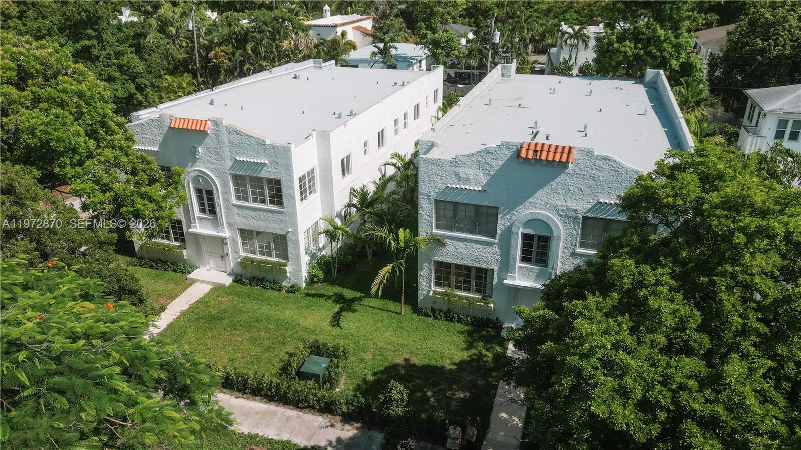 128 Northeast 46th Street, Unit 3 Miami, FL 33137 - Photo 16 of 17 an aerial view of multiple houses with a yard