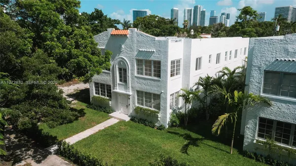 a view of a building with a yard