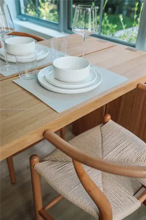 a living room with a bed and a table