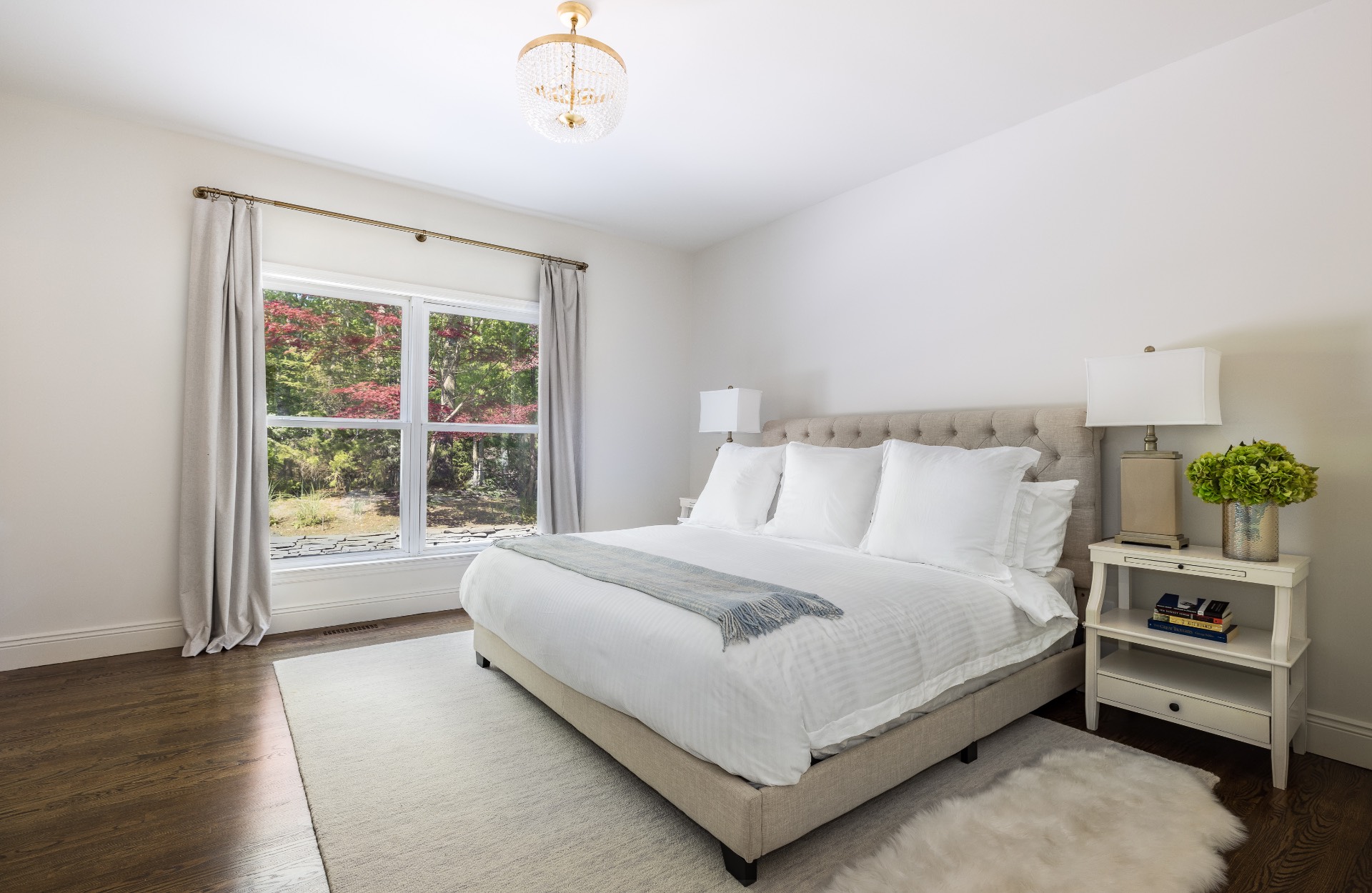 222 2 Holes Water Road East Hampton, NY 11937 - Photo 22 of 32 a bedroom with a bed and a window