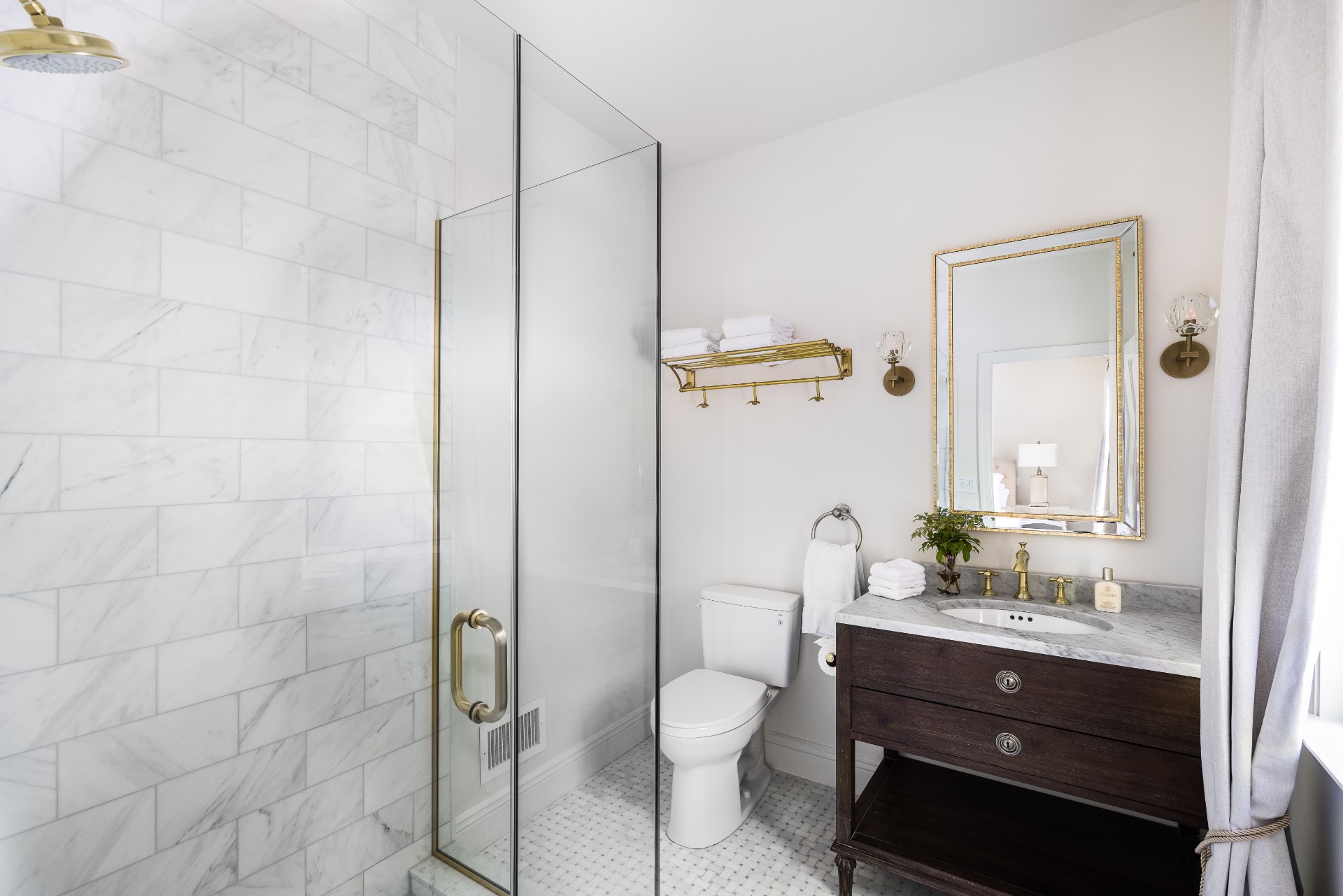 222 2 Holes Water Road East Hampton, NY 11937 - Photo 23 of 32 a bathroom with a toilet a sink and mirror