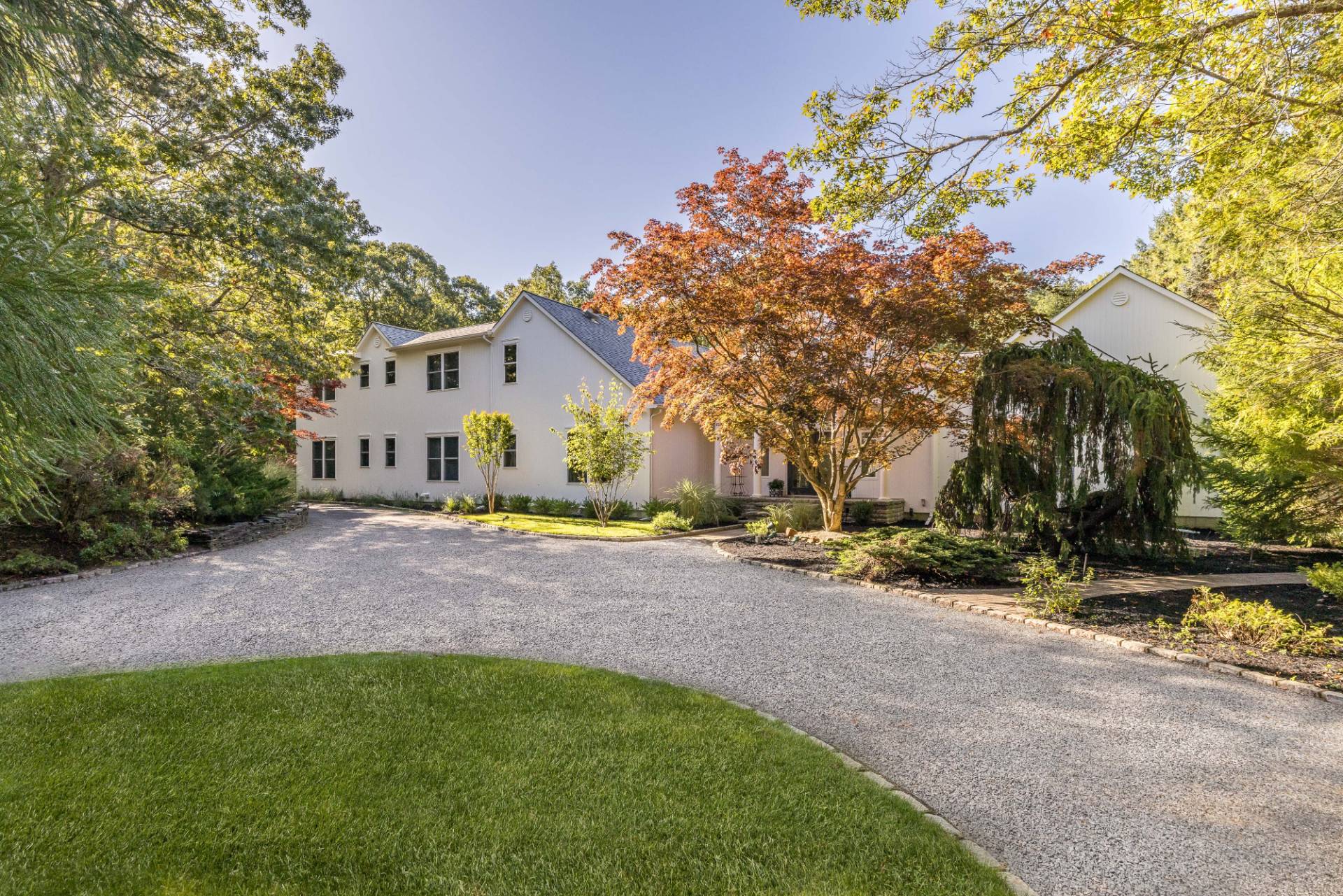 222 2 Holes Water Road East Hampton, NY 11937 - Photo 31 of 32 a view of a house with a yard and garage