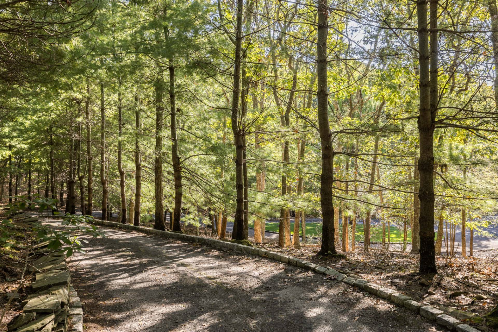 222 2 Holes Water Road East Hampton, NY 11937 - Photo 32 of 32 a view of a street with trees