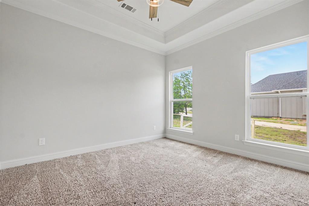 530 P R 491 Leonard, TX 75452 - Photo 26 of 35 Spacious room featuring neutral carpeting, light gray walls, and white trim