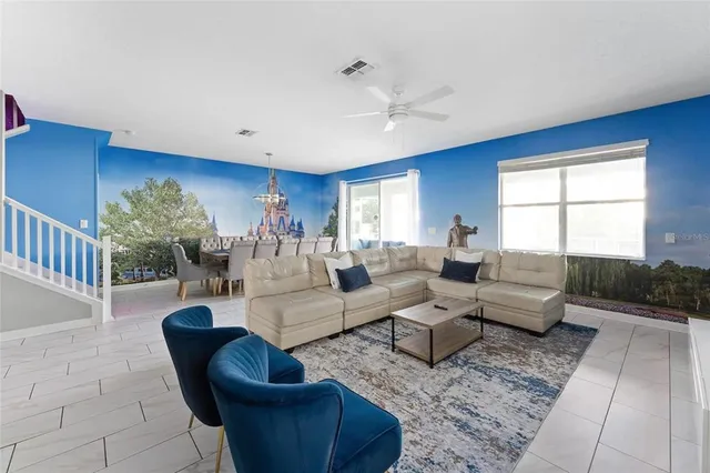 a view of a dining room with furniture and chandelier