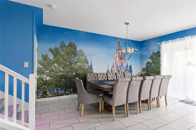 a large kitchen with stainless steel appliances granite countertop a sink a stove a refrigerator and a oven