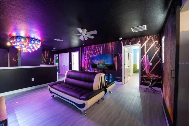 a children room with toys and a flat screen tv