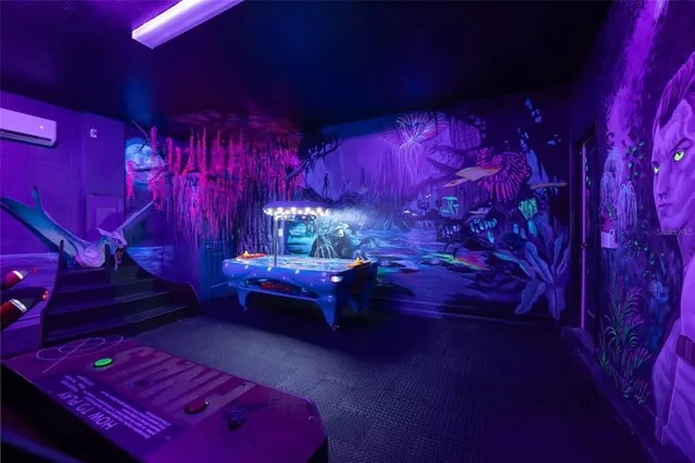 a view of a room with gym equipment and screen