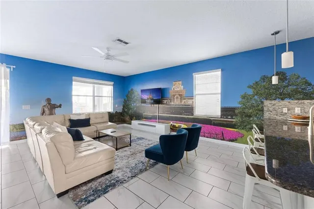 a living room with furniture and a large window