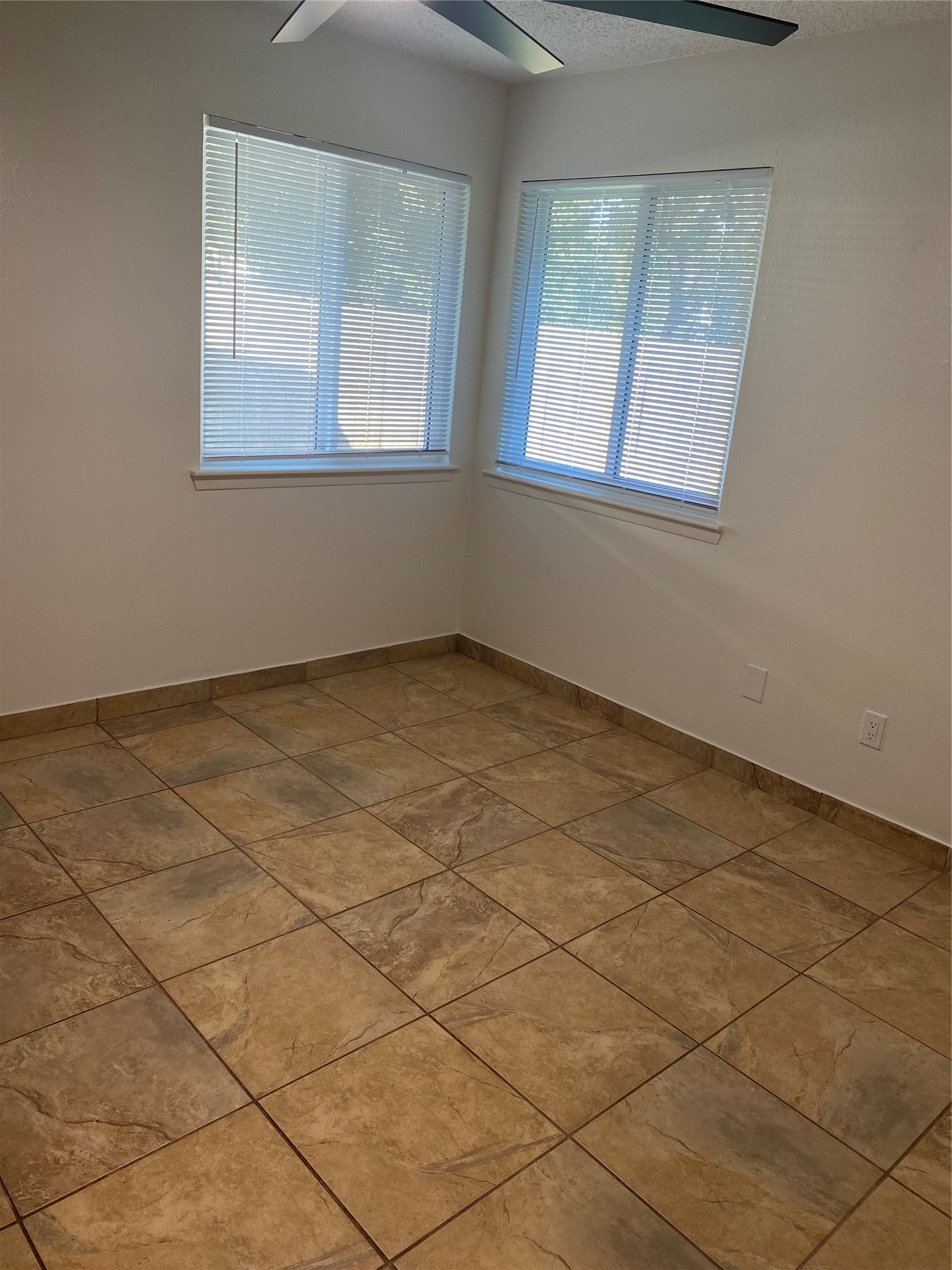 3107 Raccoon Run Spring, TX 77373 - Photo 17 of 35 2nd bedroom with 72" ceiling fan, new blinds and fresh Sherwin Williams' alabaster paint.