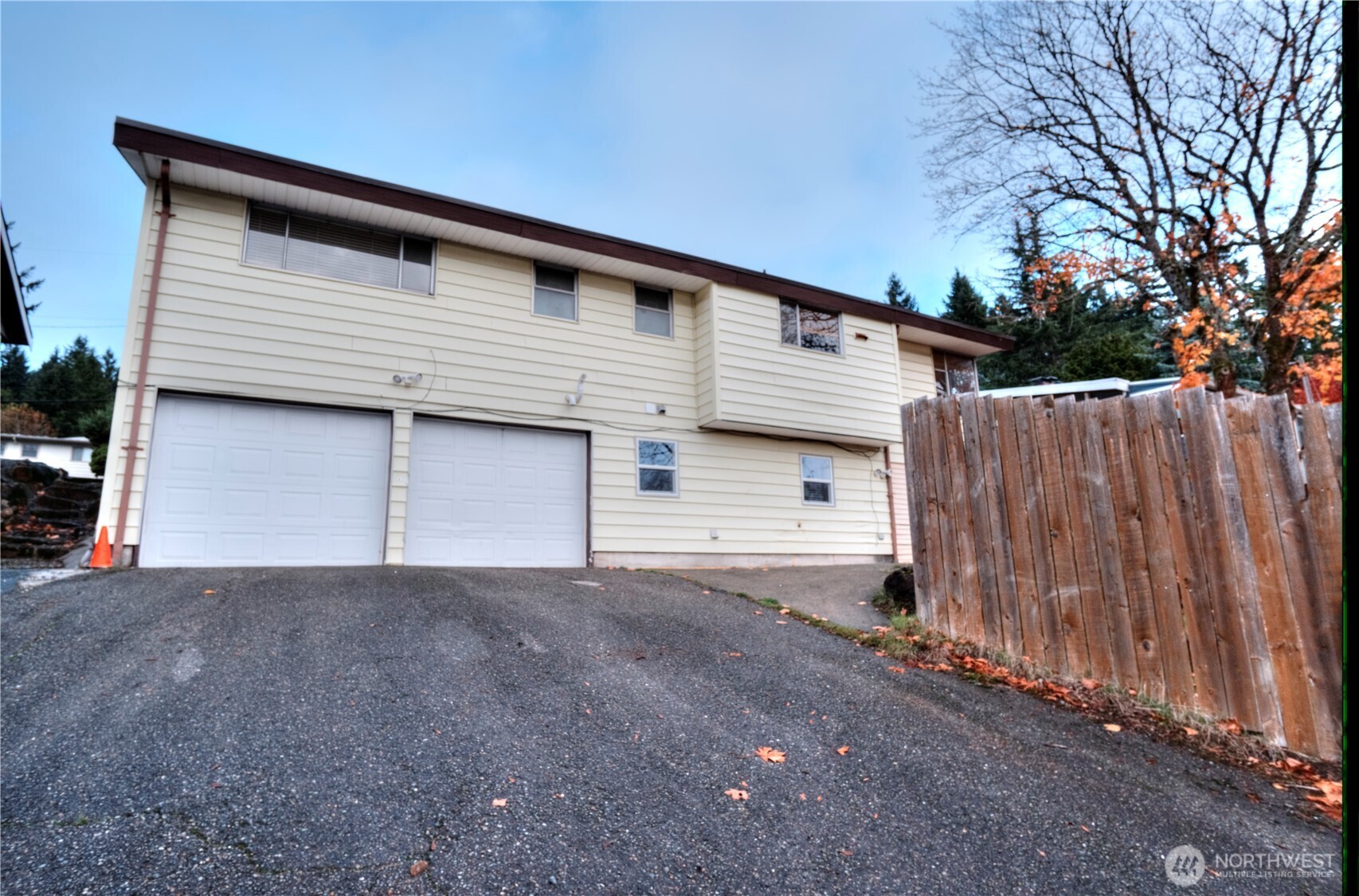 6605 South 127th Place Seattle, WA 98178 - Photo 1 of 28 a front view of a house with a garage