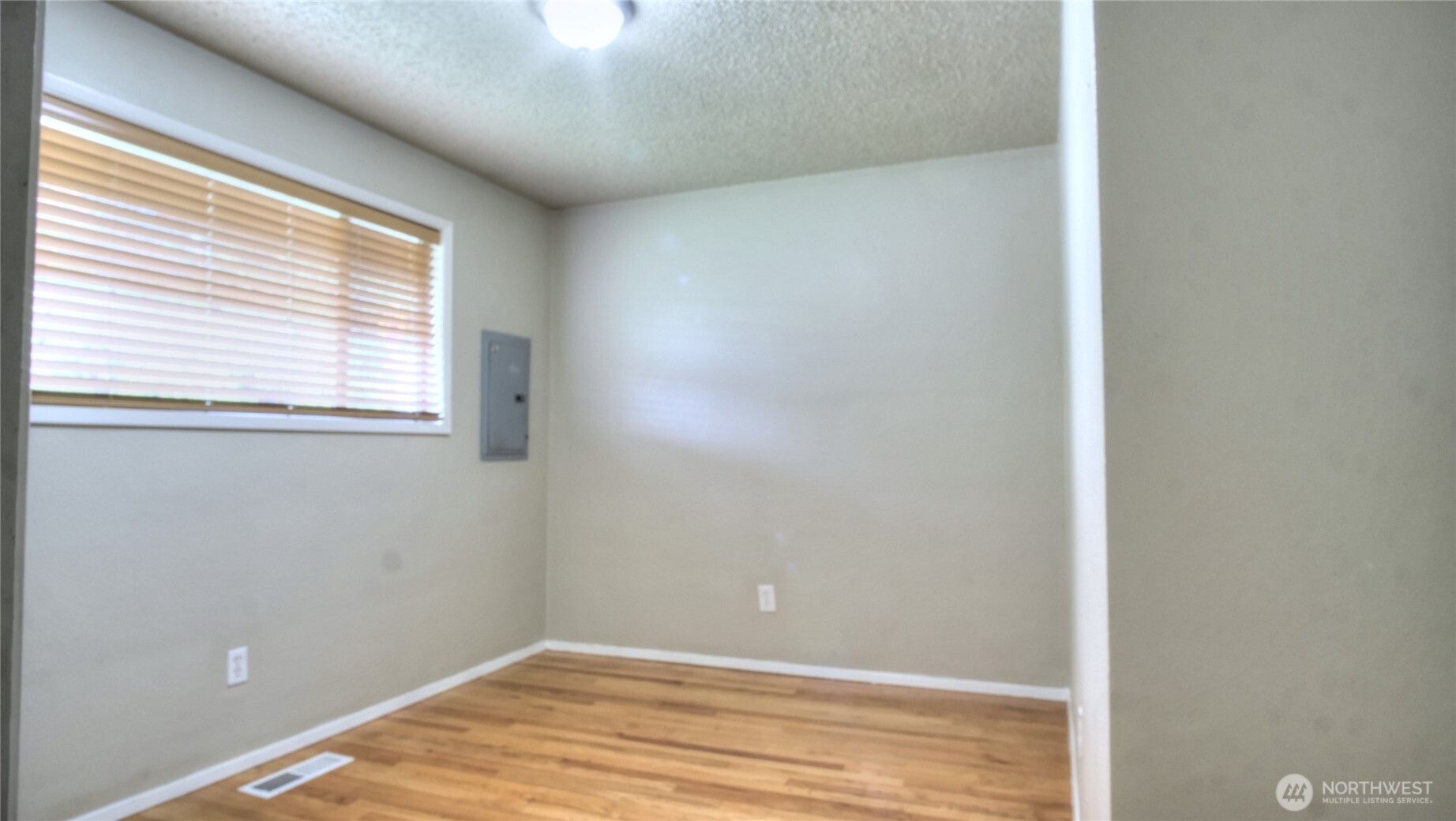6605 South 127th Place Seattle, WA 98178 - Photo 18 of 28 a view of a room that has a window in it