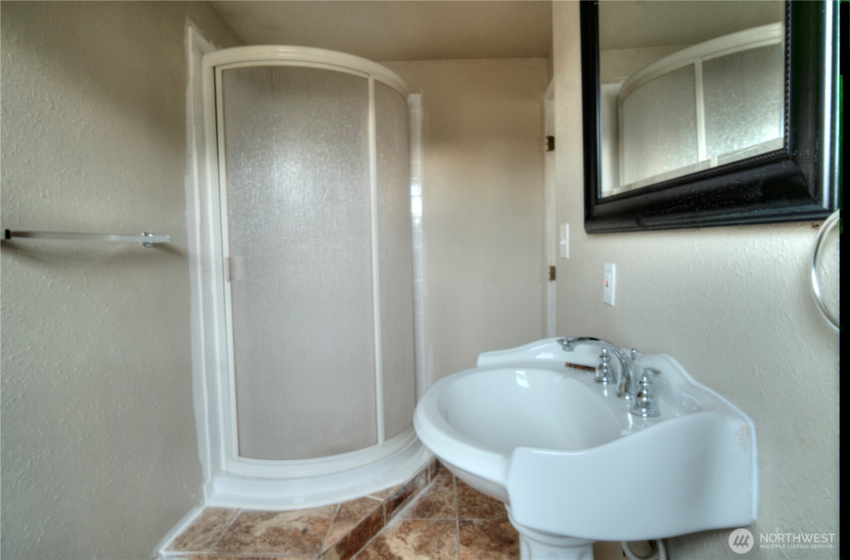 6605 South 127th Place Seattle, WA 98178 - Photo 23 of 28 a bathroom with a sink and a mirror