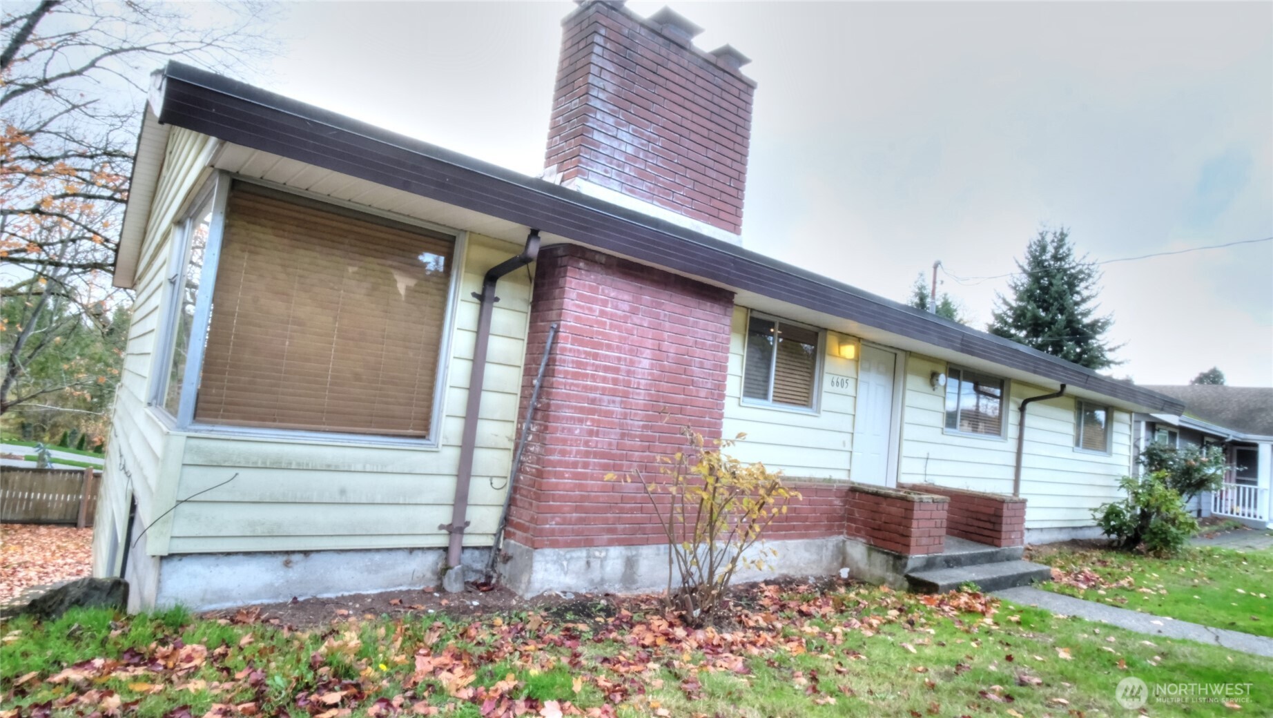 6605 South 127th Place Seattle, WA 98178 - Photo 6 of 28 a front view of a house with garden