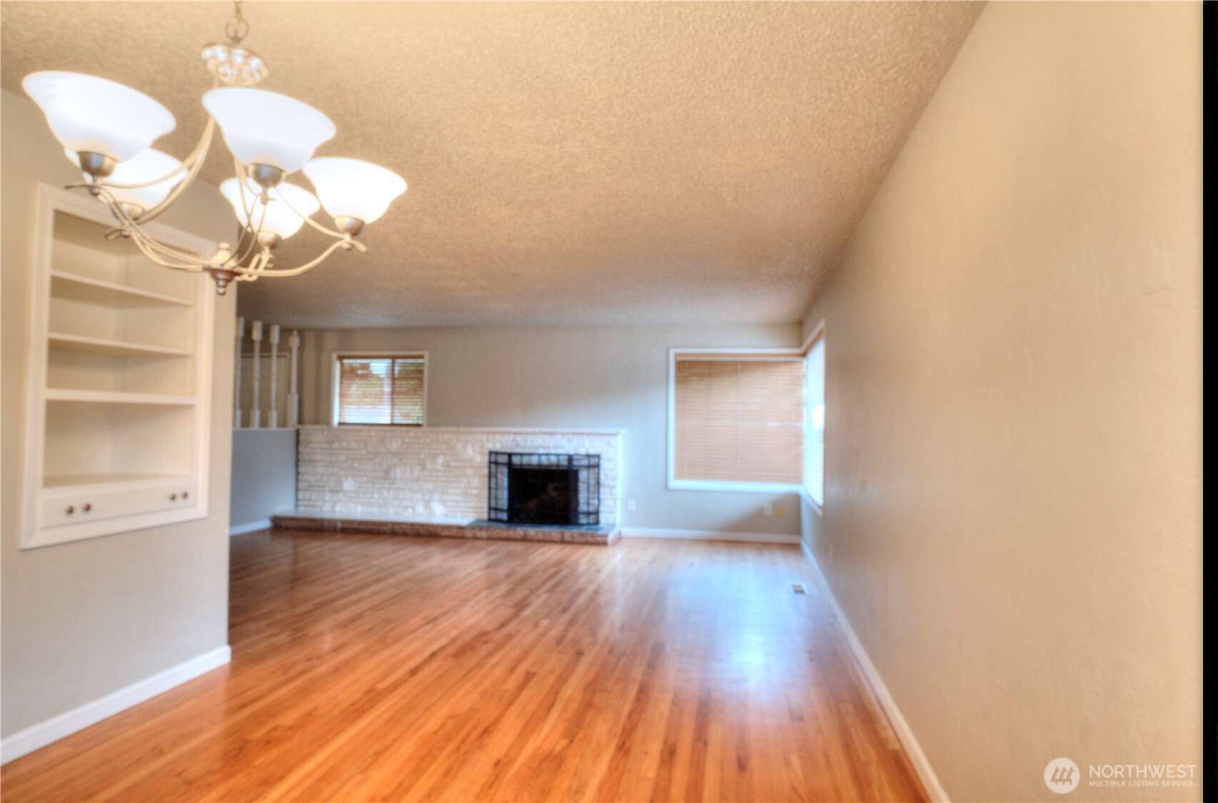 6605 South 127th Place Seattle, WA 98178 - Photo 7 of 28 a view of a livingroom with wooden floor