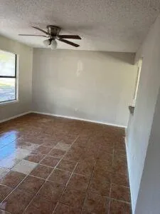 a view of a room with rack on the wall and a window