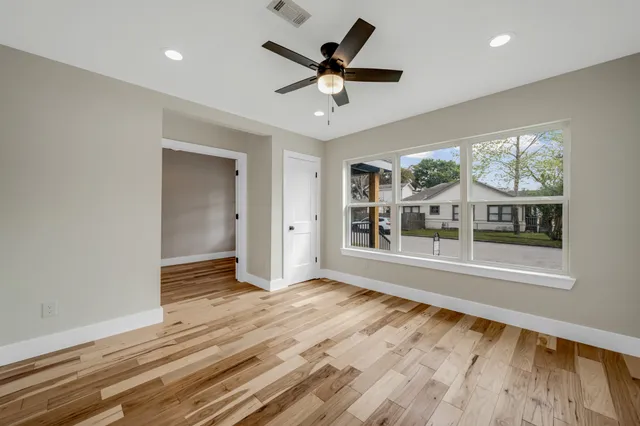 a kitchen with kitchen island a sink stainless steel appliances and refrigerator