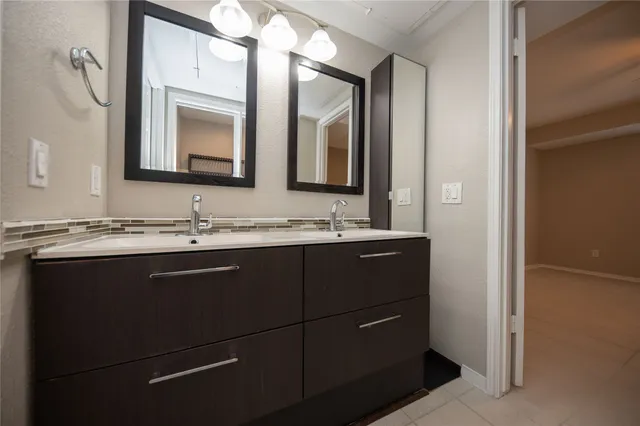 a bathroom with a bathtub and a sink