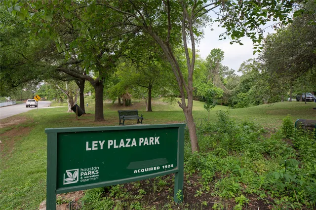 a view of a bench in the middle of a garden