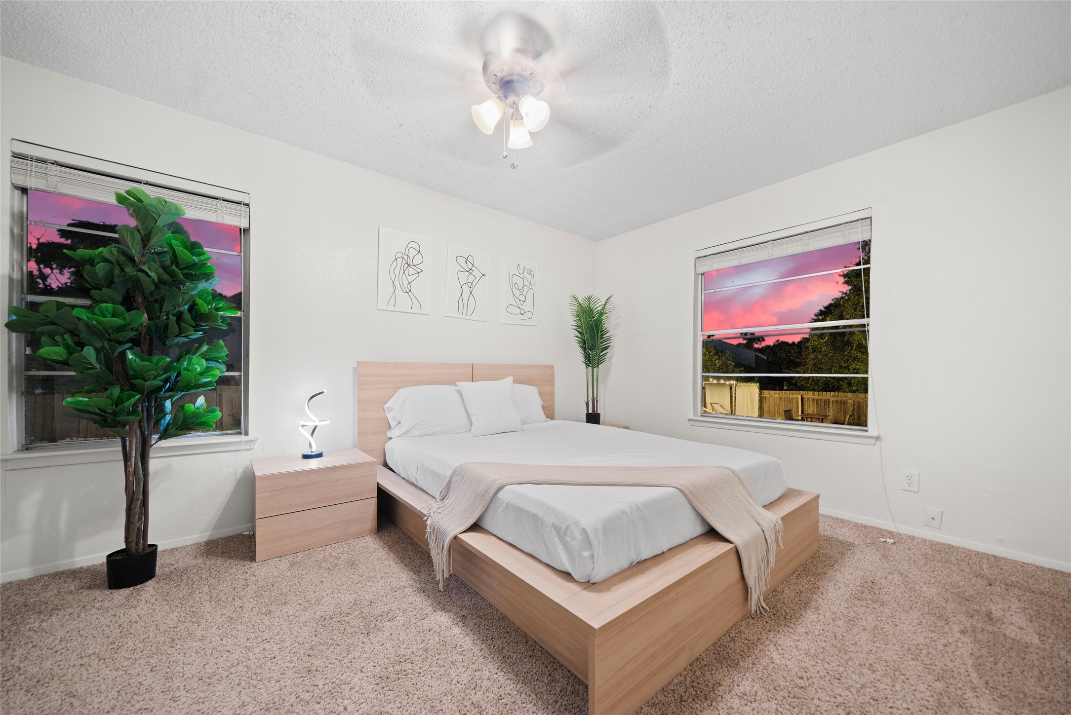 3507 Alpine Circle Austin, TX 78704 - Photo 24 of 30 a bedroom with a bed and a potted plant
