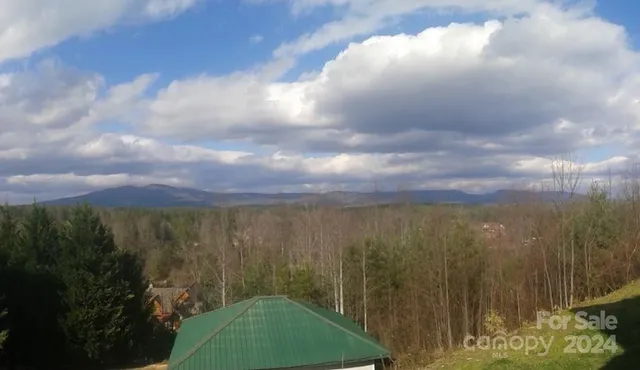 a view of a mountain with a outdoor space